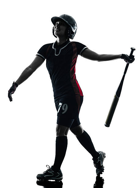 istock woman playing softball players silhouette isolated 492550328