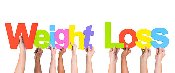istock Multiethnic Arms Raised Holding Texts Weight Loss 492569087