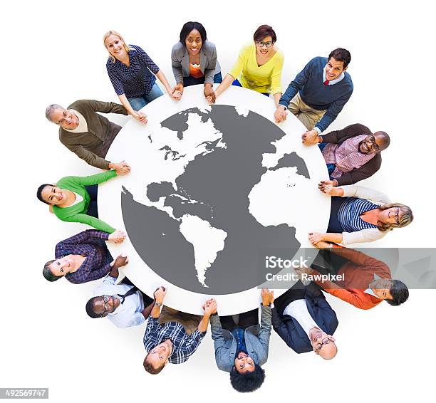 Multiethnic Diverse People In A Circle Holding Hands Stock Photo - Download Image Now