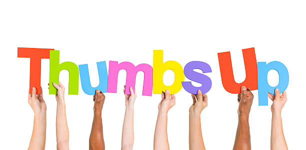istock Diverse Hands Holding the Word Thumbs Up 492570301