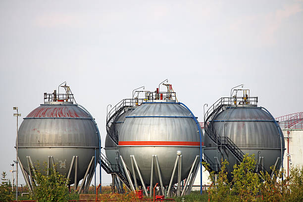istock four oil tanks on field 492570924