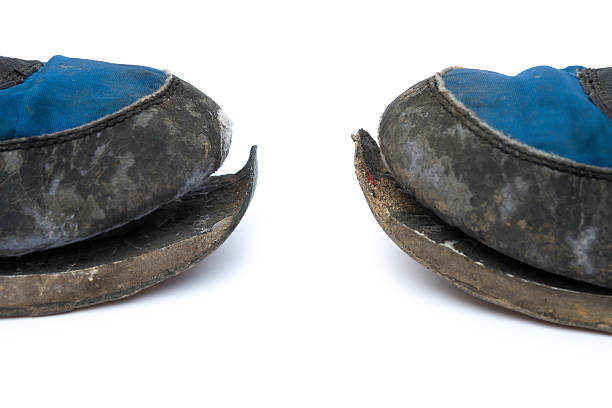 istock close up of broken shoes on white background 492571749
