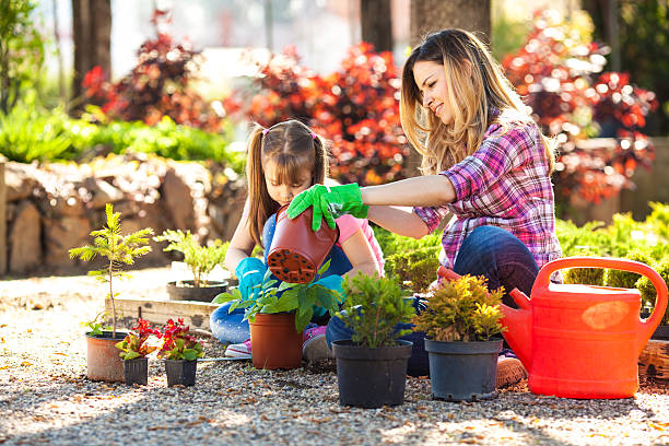 istock Mother and daughter in garden. 492571891
