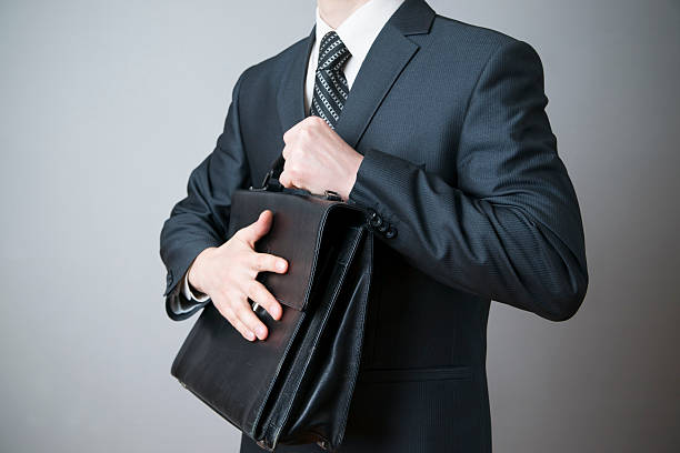 istock Businessman with briefcase in hand 492572133