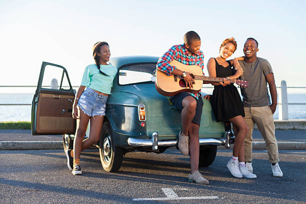 African hipster jamming to a tune stock photo