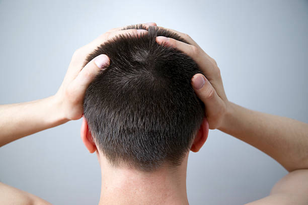 istock Headache of the man on gray background 492573489
