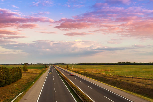 istock Cars speeding on a highway 492574171