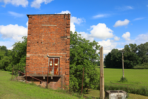 Detail of small standalone brick building in vivid colors of nice sunny day