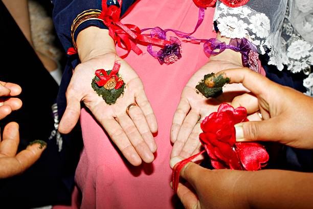 Bride hennaed her hands with together one gold stock photo