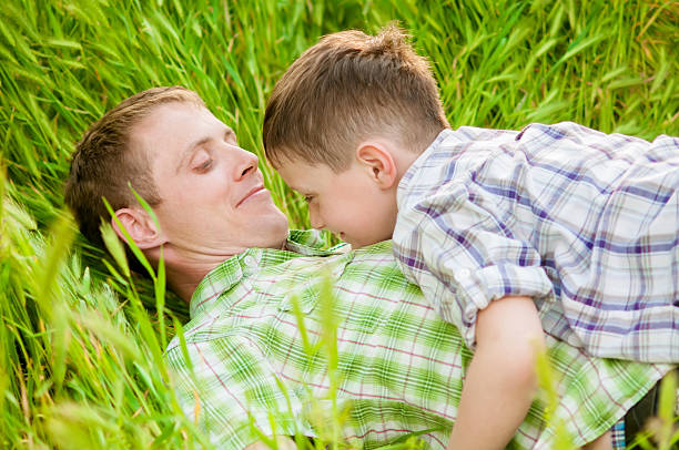 father and boy on a summer stock photo