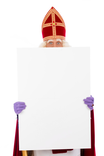 Sinterklaas holding  blank card. isolated on white background. Dutch character of Santa Claus
