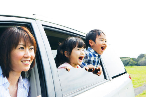 Family looking prairei from car window