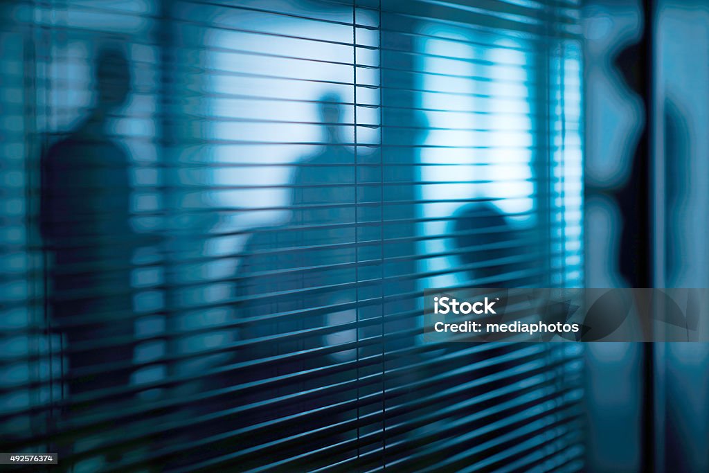 Secret meeting Silhouettes of people in the room with jalousie Conspiracy Stock Photo