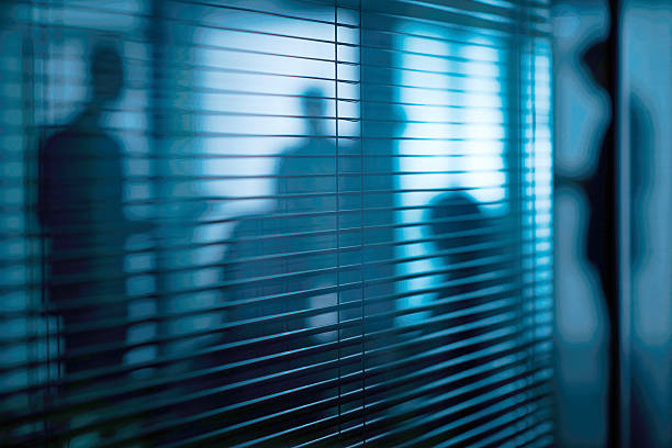 Secret meeting Silhouettes of people in the room with jalousie conspiracy photos stock pictures, royalty-free photos & images