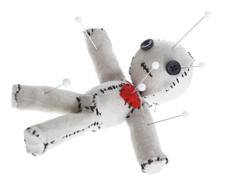 Cute handmade voodoo doll (Made completely by me) with pins on a white background