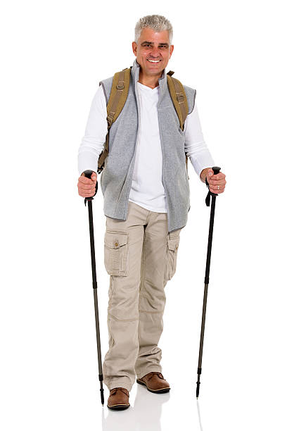 istock senior man with backpack and hiking poles 492578208