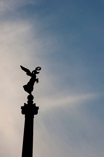 istock silhouette of angel from Rome before sunset time 492579116