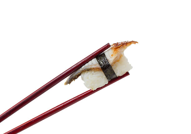 Dragon sushi rolls with eel decorated with sesame on the white background