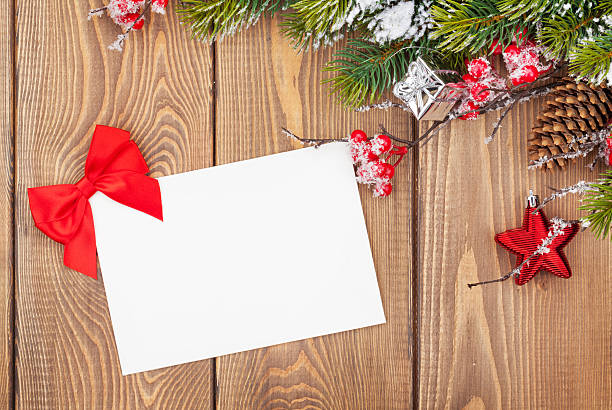 istock Christmas tree branch and blank greeting card 492582158
