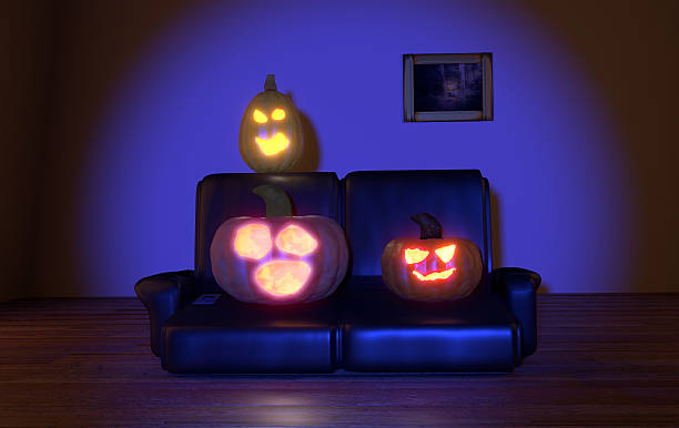 horrified pumpkins watching tv at night