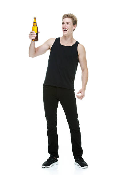 Cheerful man holding beer bottle Cheerful man holding beer bottlehttp://www.twodozendesign.info/i/1.png alcoholism alcohol addiction drunk stock pictures, royalty-free photos & images