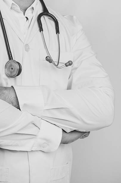 istock Doctor with a stethoscope, black and white tone 492584746