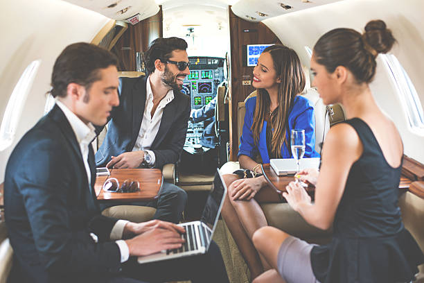 istock Businesspeople in private jet airplane 492585388