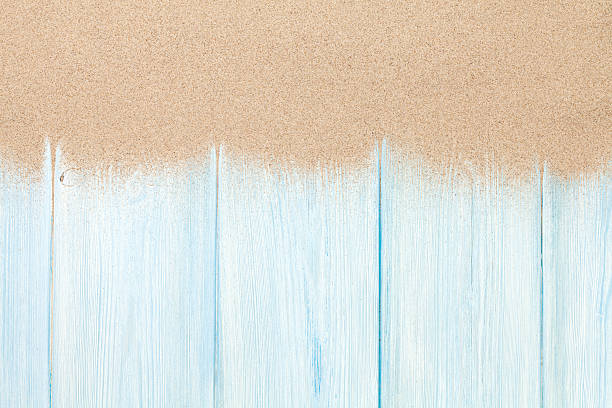 istock Sea sand on wooden floor 492585514