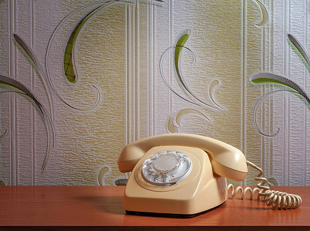 istock Retro telephone on wooden table in front gradient background 492586464