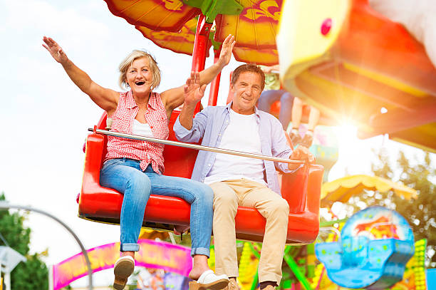 istock Senior couple in amusement park 492586676