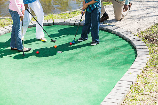 istock Family playing miniature golf 492594485