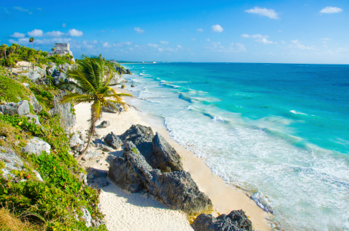 Young Caucasian woman walking on the  of seaside on  Isla Mujeres