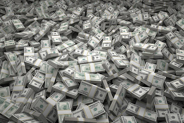 Money Pile Bundles of $100 USD Notes Bundles of $100 US dollar bills scattered randomly. Billions of dollars worth of money spread over the ground and viewed from above. A sea of money and great background. stack stock pictures, royalty-free photos & images