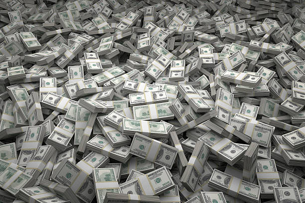 Money Pile Bundles of $100 USD Notes Bundles of $100 US dollar bills scattered randomly. Billions of dollars worth of money spread over the ground and viewed from above. A sea of money and great background. billion stock pictures, royalty-free photos & images