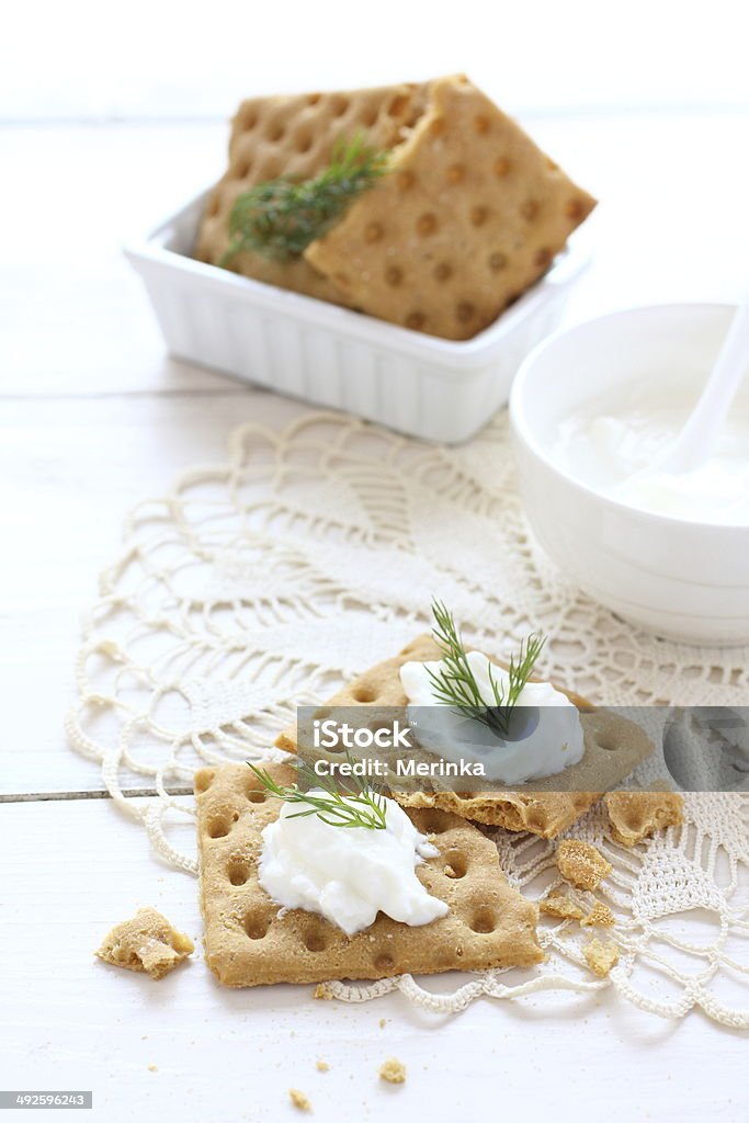 Flat gluten free bread with cream cheese and dill topping Appetizer Stock Photo