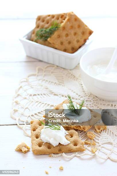 Flat Gluten Free Bread With Cream Cheese And Dill Topping Stock Photo - Download Image Now