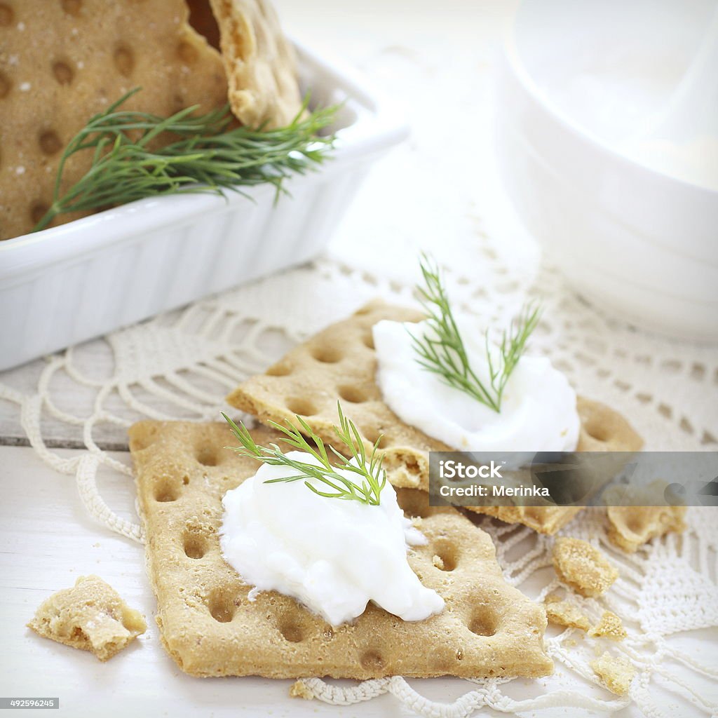 Snack gluten free crispbread with cream cheese and dill Snack gluten free crispbread with cream cheese and dill with retro filter effect Appetizer Stock Photo