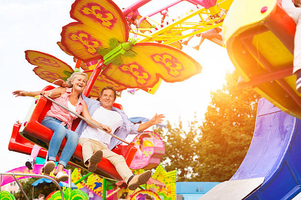 istock Senior couple in amusement park 492596354