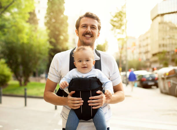 2,600+ Man With Baby Carrier Stock Photos, Pictures & Royalty-Free