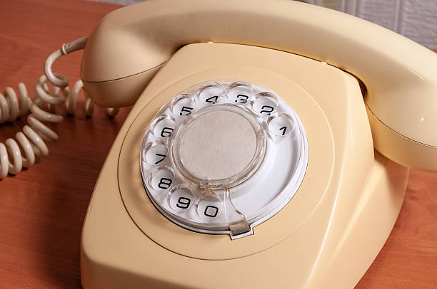 istock Retro telephone on wooden table in front gradient background 492596464