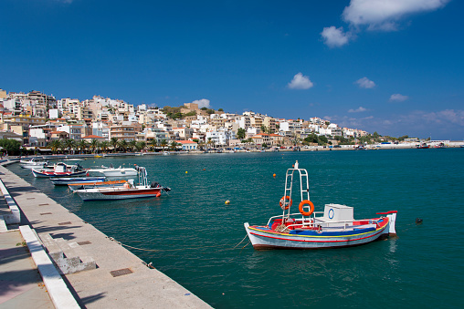 Fishing boats along the waterfront promenade in the town Sitia on the island of Crete.