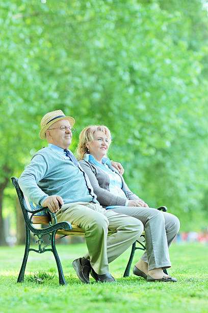 istock Elderly seated on bench and relaxing outdoors 492596763