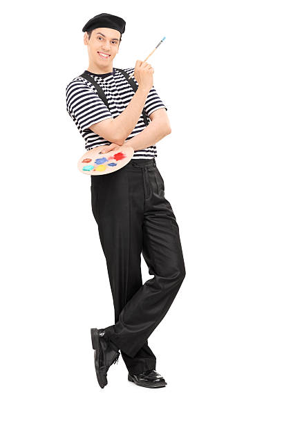 istock Happy male painter holding a paintbrush 492596799