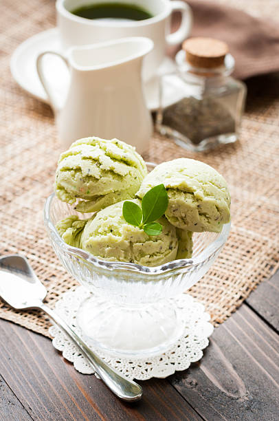 istock Green Tea Ice Cream on white wood board 492597690