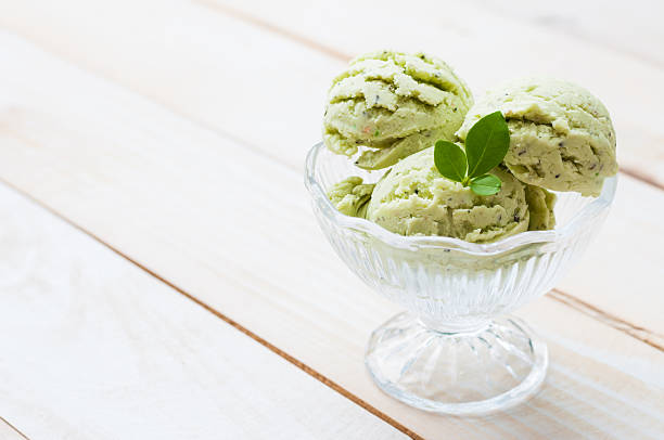 istock Green Tea Ice Cream on white wood board 492597994