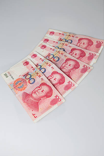 istock Chinese yuan lie side by side 492598771