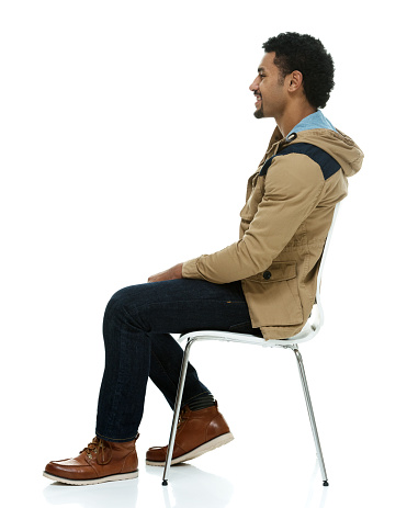 Smiling man on chair and looking awayhttp://www.twodozendesign.info/i/1.png