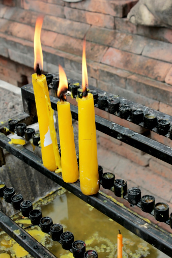 Candles for buddhism worshiping of wat phradhart lampangluang at lampang , temple in Thailand.