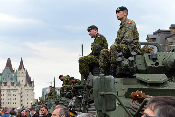 Canada honours veterans who served in Afghanistan Ottawa, Canada - May 9, 2014: Soldiers who served in the Canadian Forces in Afghanistan are honored on Parliament Hill during national Day of Honour May 9, 2014 in Ottawa, Canada chateau laurier stock pictures, royalty-free photos & images