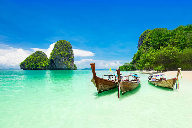 Beauty beach Beauty beach and limestone rocks, focus on the boats andaman sea photos stock pictures, royalty-free photos & images